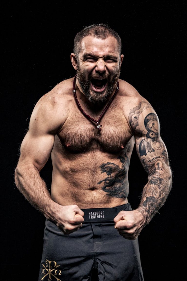 Shouting Shirtless Bodybuilder with Tattoos
