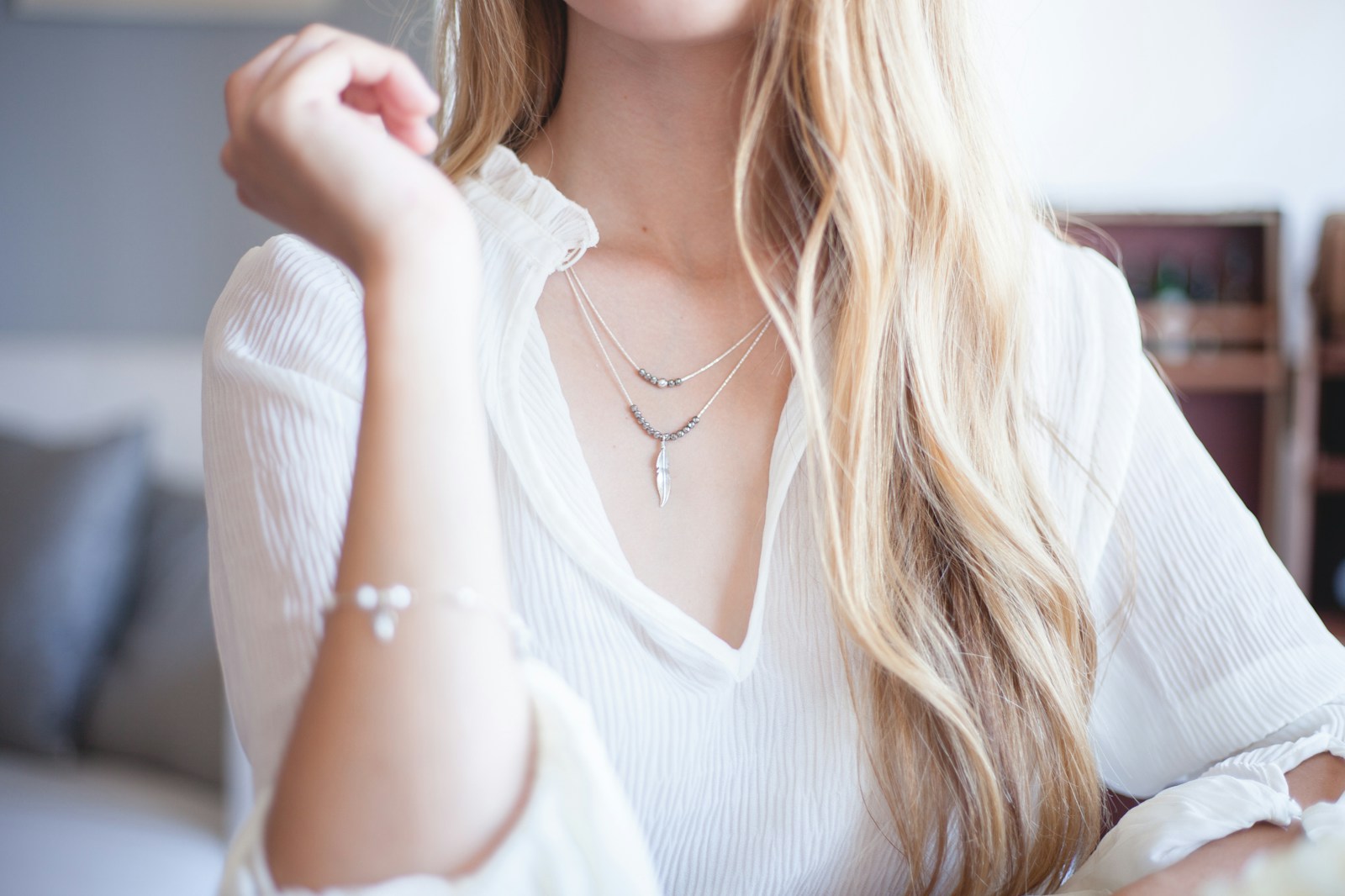 woman wearing white long-sleeved blouse